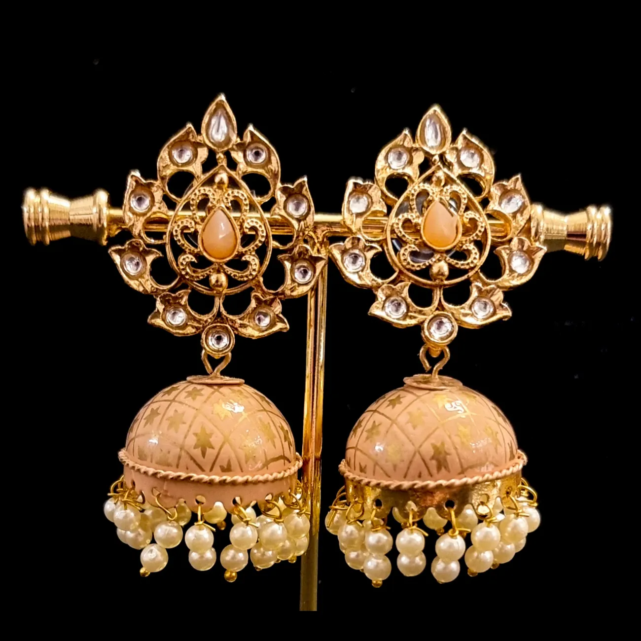 Hand crafted meenakari kundan jhumkas.