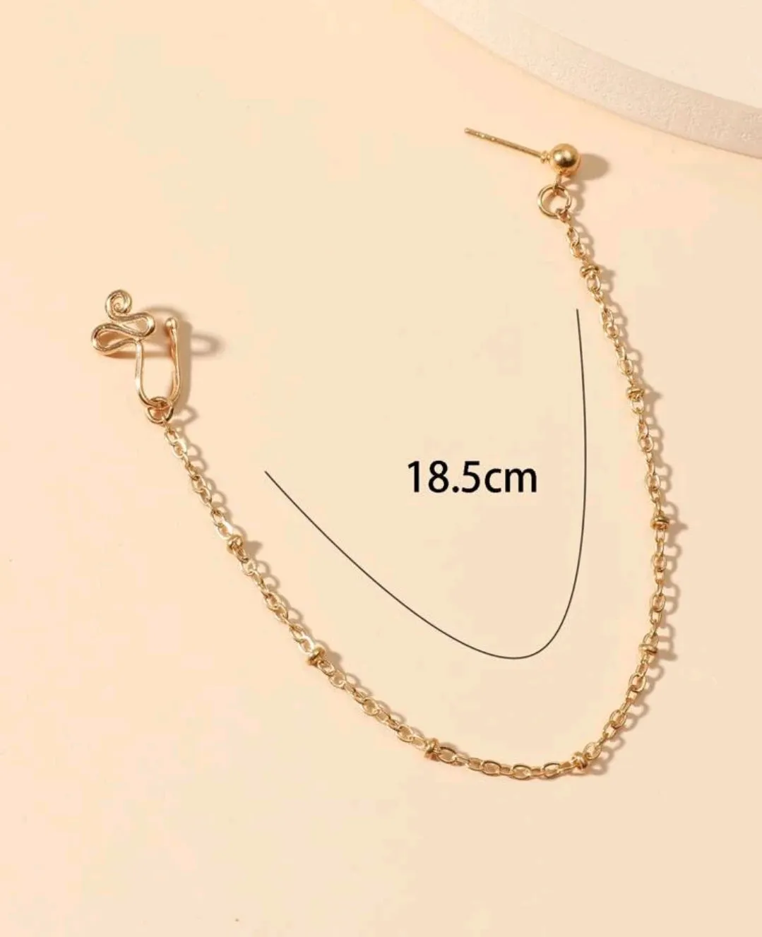 Structured Nose Ring With Chain To Ear.